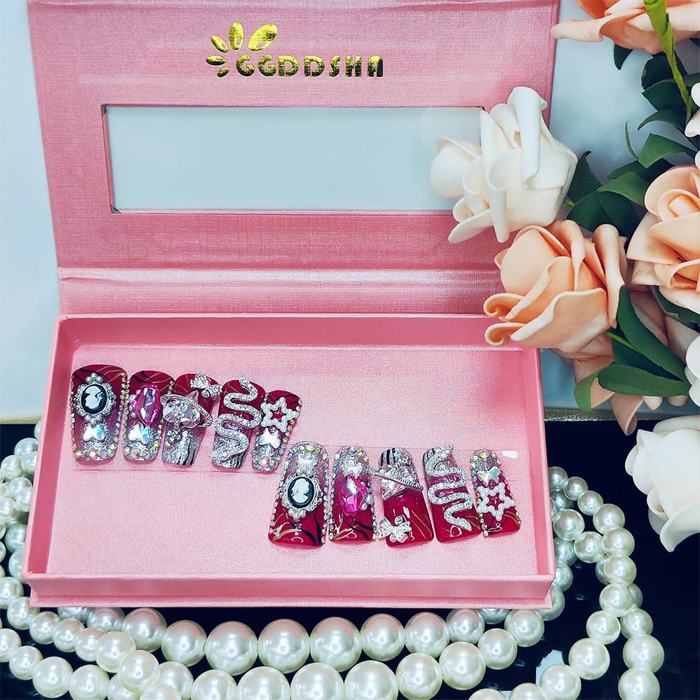 Medium square press-on nails with red and silver glitter, rhinestones, stars, butterflies, snake art