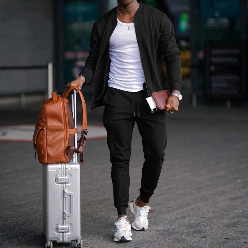 Men's zip-up long sleeve jacket and drawstring sweatpants set in black, with tapered legs