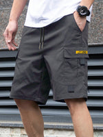 Men's dark gray utility shorts with drawstring and large side cargo flap pocket