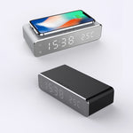Digital alarm clock with wireless charger, gray and black bases, smartphone on top