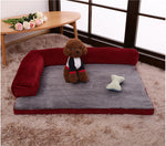 Red pet dog bed with ribbed bolsters and light gray plush mat