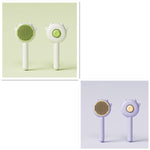 Set of two cat grooming comb brushes, green and lavender, with spiked paw heads
