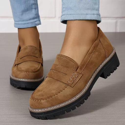 Women’s matte tan flat loafer shoes with round toe, buckle strap, and thick tread sole