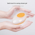 2-in-1 pet bath brush with yellow massage pad and yellow bristles, held in hands