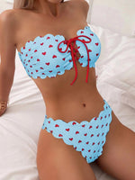 Light blue printed tube-top bikini with red hearts, tie-front drawstring, scalloped high-waist briefs