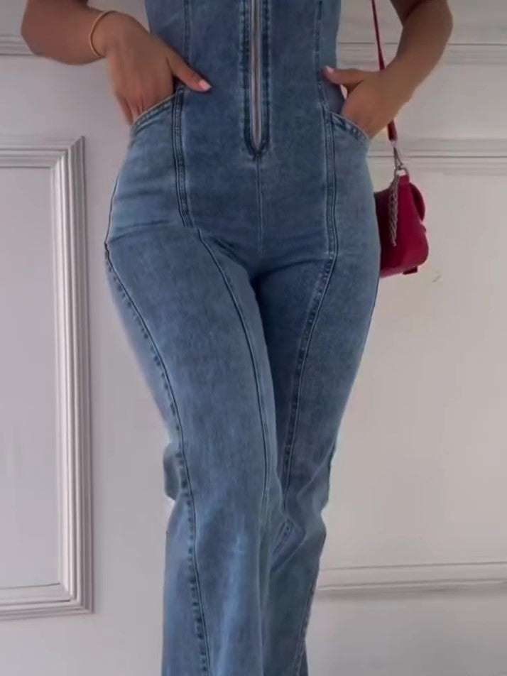Sleeveless denim jumpsuit back view with vertical seams and center back zipper
