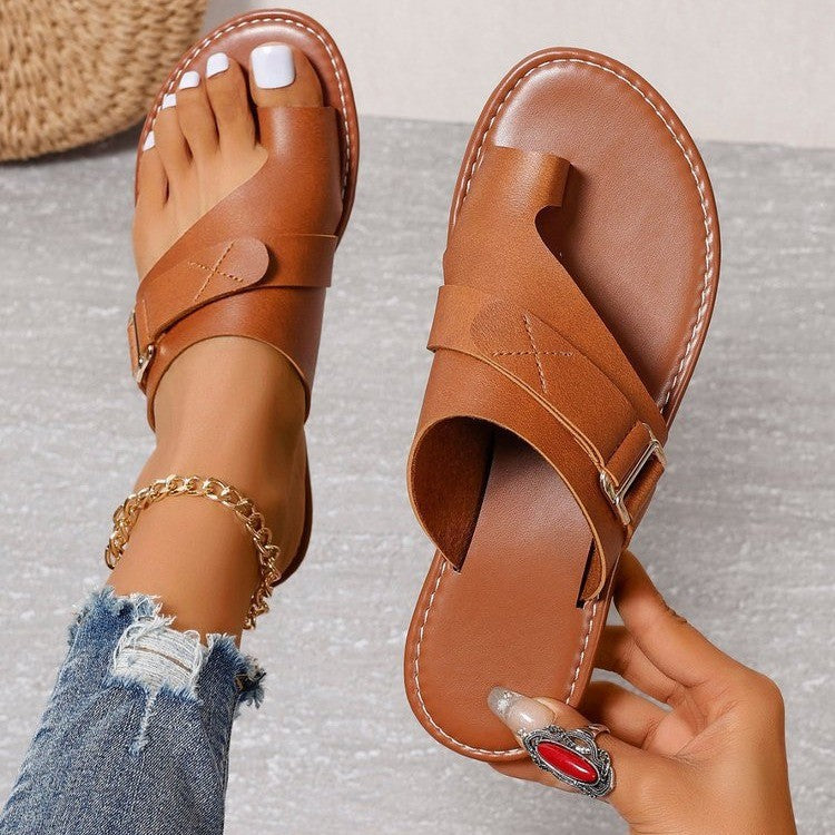 Women’s flat heel leisure slippers in tan/brown with open toe and front buckle strap