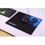 Black mouse pad with blue dragon emblem, smooth surface, and rounded corners