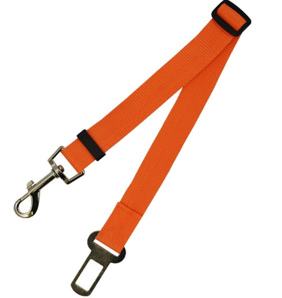 Adjustable dog car seat belt strap in orange with metal clasp and buckle adjuster.