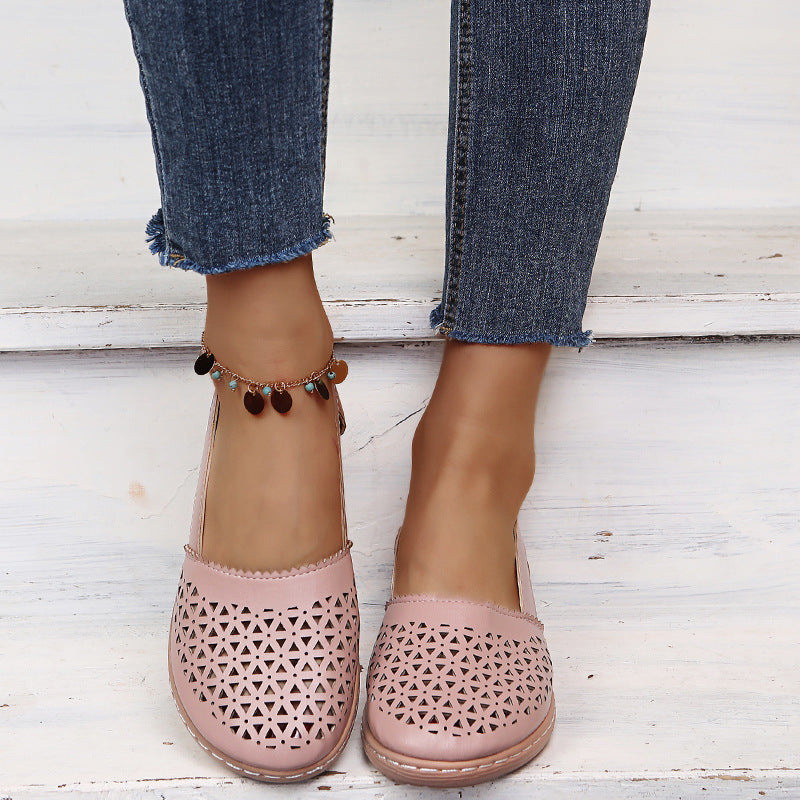 Blush pink round-toe wedge sandals with laser-cut upper and ankle strap