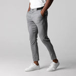 Light gray slim-fit business trousers with button waistband and straight slim legs