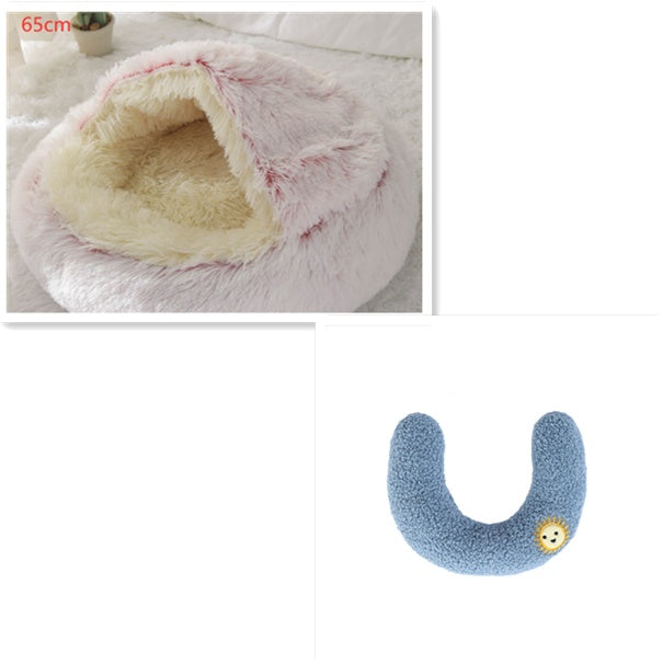 Round plush pet bed with cave-style opening, pink plush and light cream lining