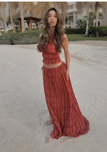Orange-red halter crop top and tiered pleated maxi skirt set with ruffled tiers
