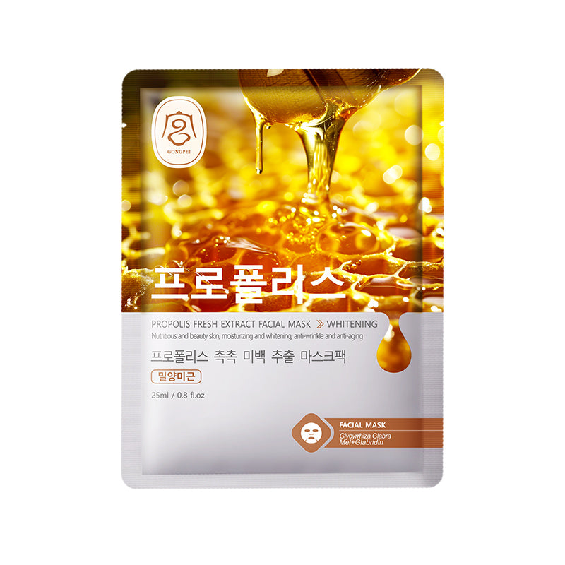 Golden facial sheet mask pouch with honey-like droplets and whitening badge