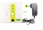 Lime-green control panel of ball launcher with power adapter and cord