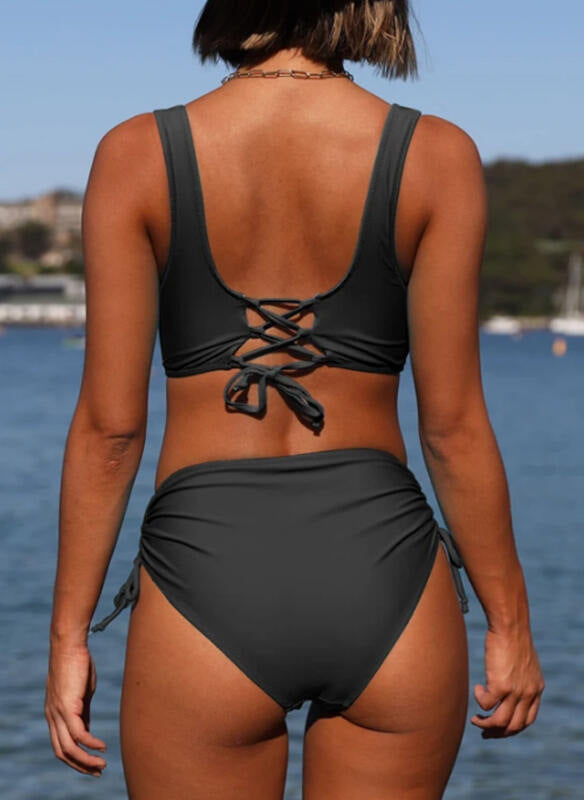 Black bikini swimsuit with open-back crisscross lace-up top and ruched high-waist bottoms