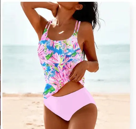 Split high-waist bikini set with pink and multicolor tropical print tank and pink bottoms