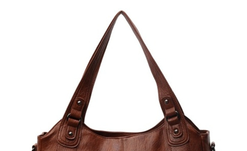 Brown PU handbag with two top handles and round metal strap details