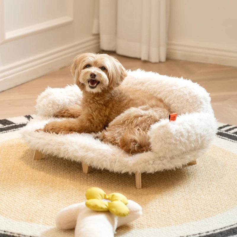 Luxury wooden pet bed with fluffy white cover and brown dog stretched out on it