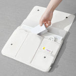 White laptop bag sleeve open with snap tabs, inner pockets, and card pocket
