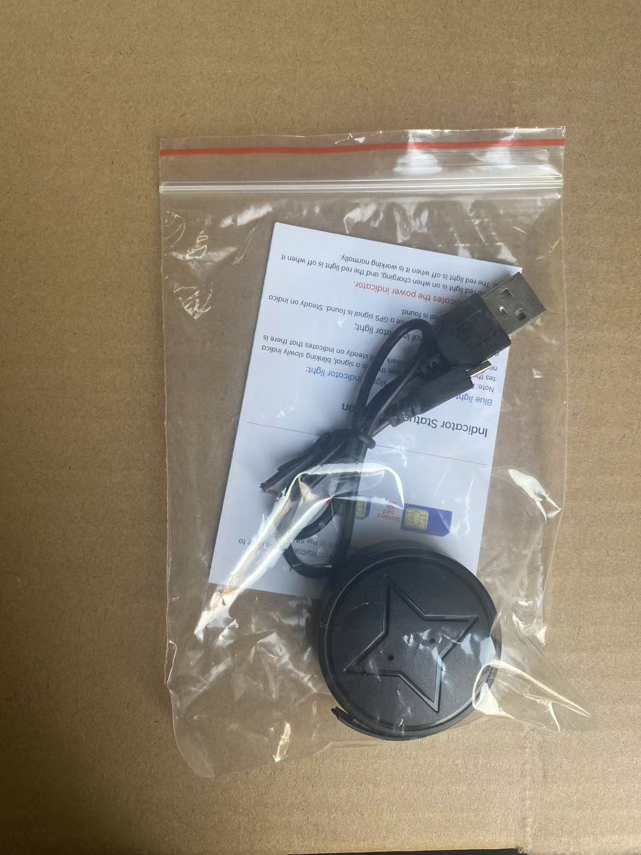 Mini GPS tracker with strong magnet accessories in plastic bag, black round device