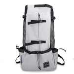 White pet dog carrier backpack with mesh side panels and black shoulder straps