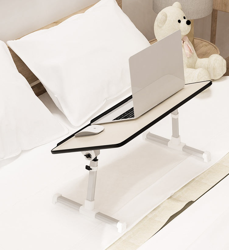 Adjustable foldable laptop desk stand with black tabletop and white adjustable legs on bed