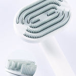 Pet hair removal comb close-up of light bristles inside the rotating base