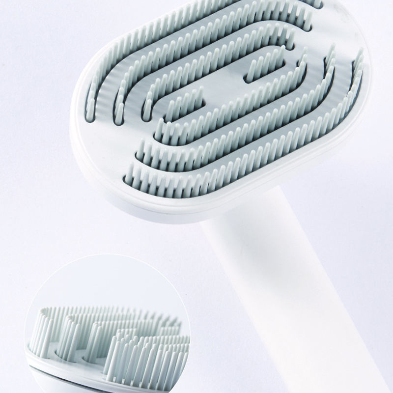 Pet hair removal comb close-up of light bristles inside the rotating base