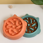 Orange and green slow feeder pet bowls with raised ridges for slow eating