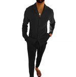 Black long-sleeve lapel shirt and slim trousers set, front view with dark button placket.