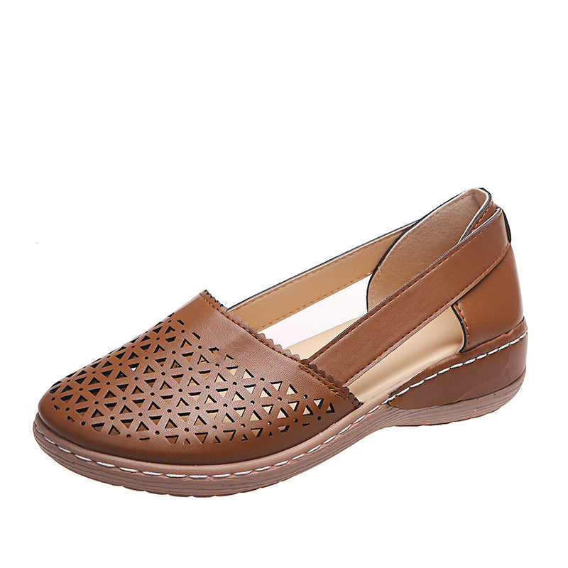 Tan brown perforated women's wedge sandals with round toe and sling strap