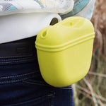 Yellow pet treat waist bag clipped to jeans with silicone closure