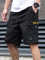 Men's black utility shorts with drawstring and large side cargo flap pocket