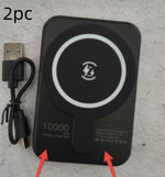 Black magnetic wireless power bank kit with USB cable and glowing wireless contact