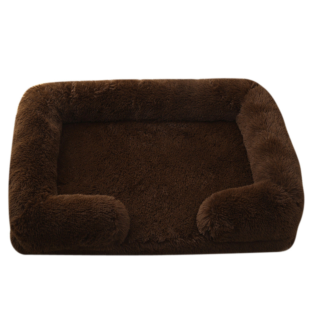 Brown plush dog bed with padded sides and rounded bolster base