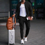 Men's zip-up long sleeve jacket and drawstring sweatpants set in black, tapered legs