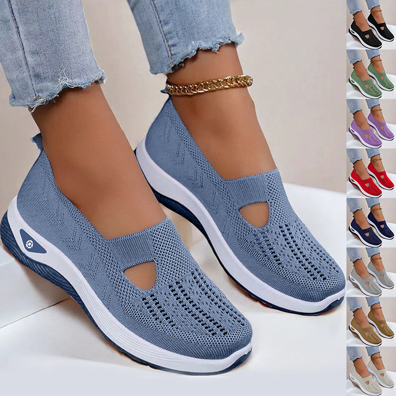 Blue mesh slip-on flat shoes with oval cutouts and white cushioned soles
