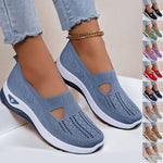 Blue mesh slip-on flat shoes with oval cutouts and white cushioned soles