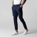 Navy slim-fit business trousers with elastic waistband, button closure, front pockets