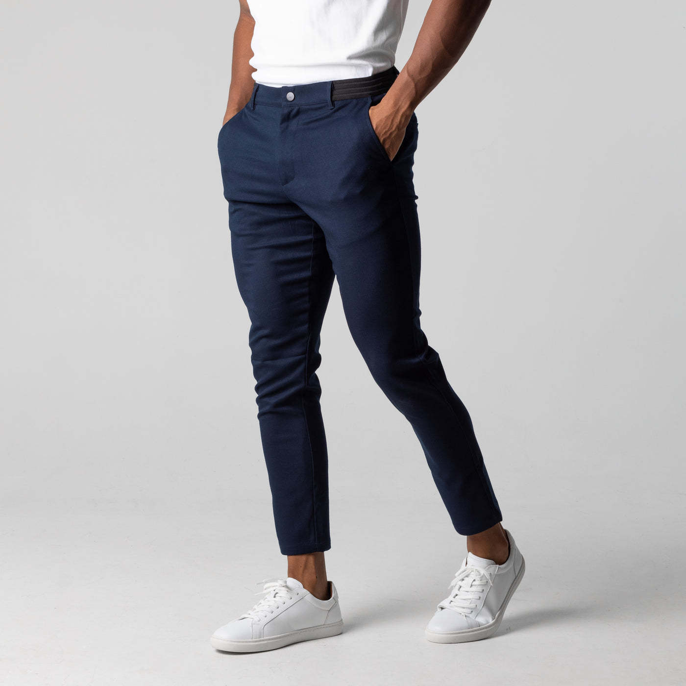 Navy slim-fit business trousers with elastic waistband, button closure, front pockets