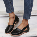 Black perforated women's wedge sandals with round toe and sling strap