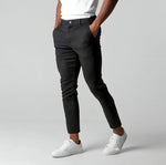 Black slim fit business suit pants with button waistband and straight tapered legs