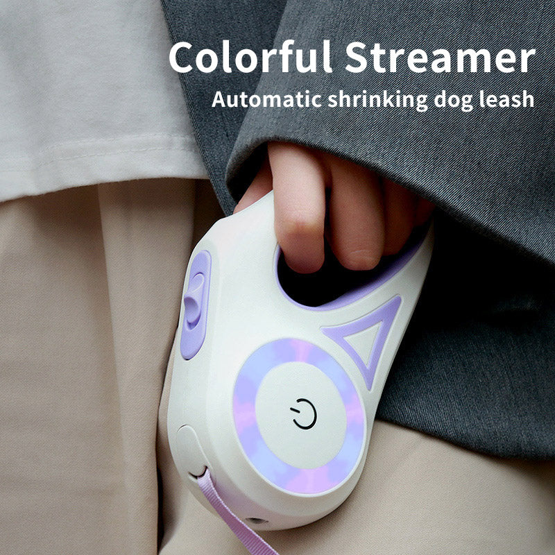 Purple retractable pet leash with LED ring, white controller, and attached fabric strap