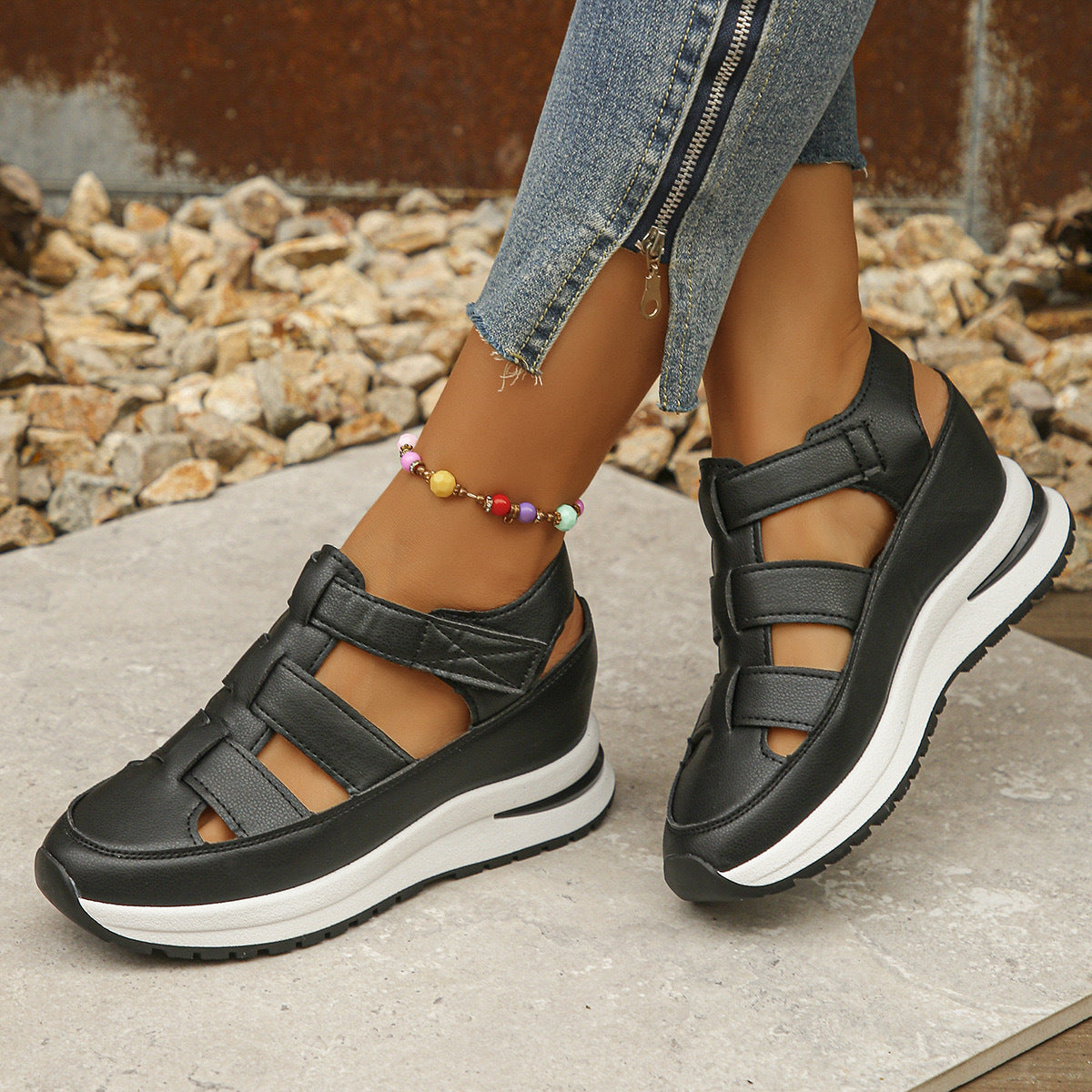 Black wedge platform sandals with multiple straps and hook-and-loop closure