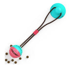 Blue-green suction cup tug toy with round spiky ball and brown cord
