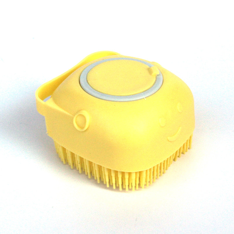 Yellow silicone pet bath massage brush with short bristles and gray inset ring