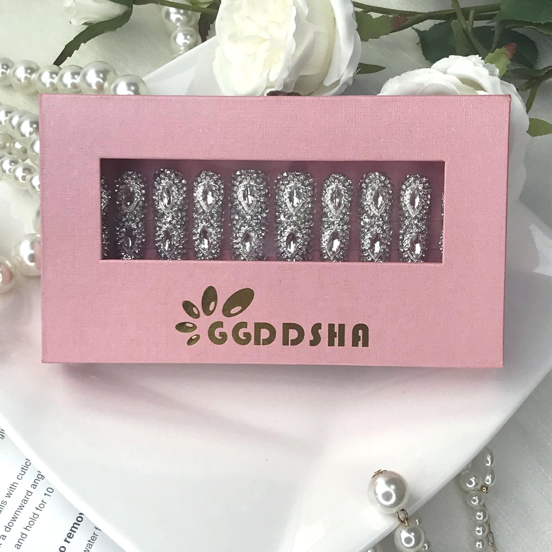 Press-on nails box showing silver rhinestone 3D crystal long nail row