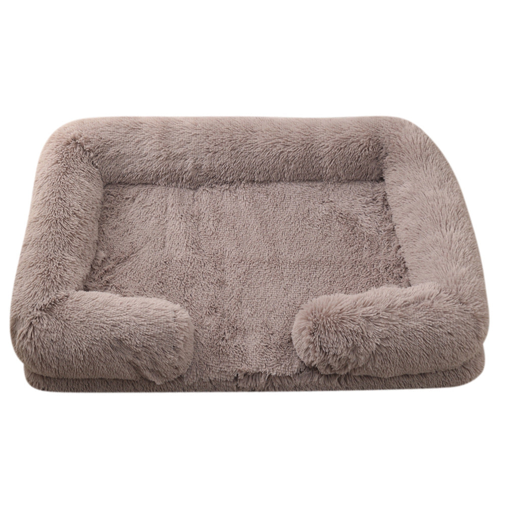 Taupe plush dog bed with padded sides and rounded bolster base