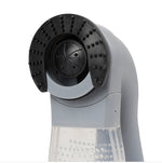 Portable pet hair vacuum cleaner showing silicone bristle roller head and clear dust chamber